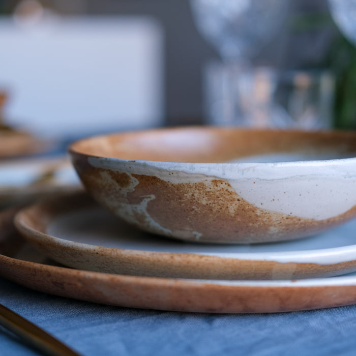 Rustic dinnerware set inspired by grandmas stoneware in brown and blues with reactive glaze