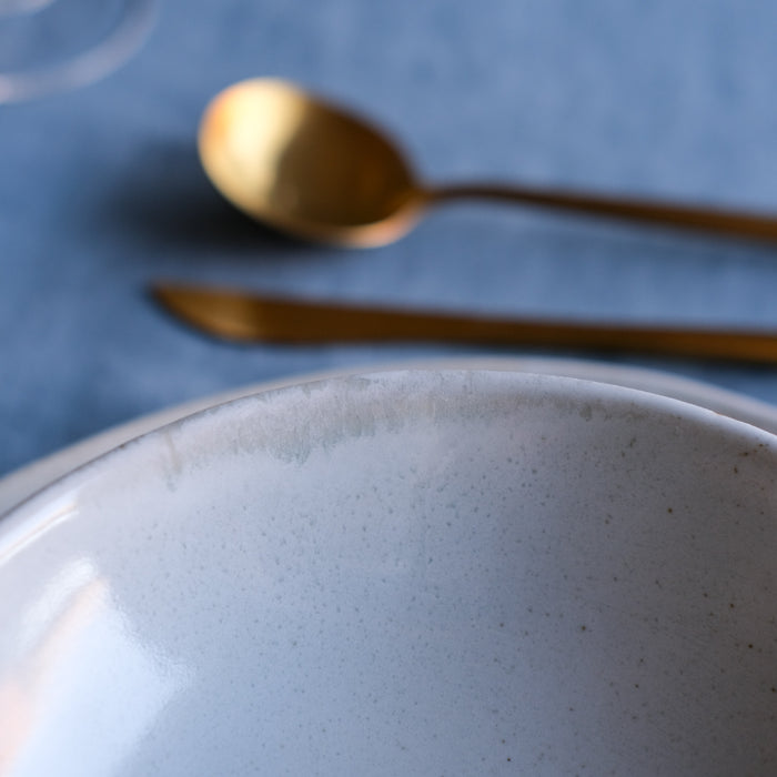 REactive glaze on handmade ceramic breakfast bowl in blue and brown