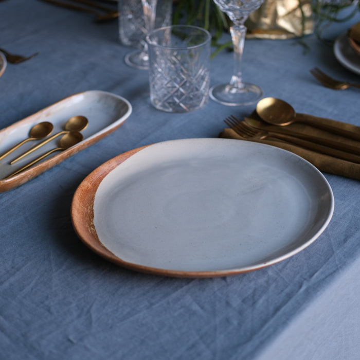 Large Handmade Dinner plate in rustic blue and brown hand dipped on blue linen tablecloth