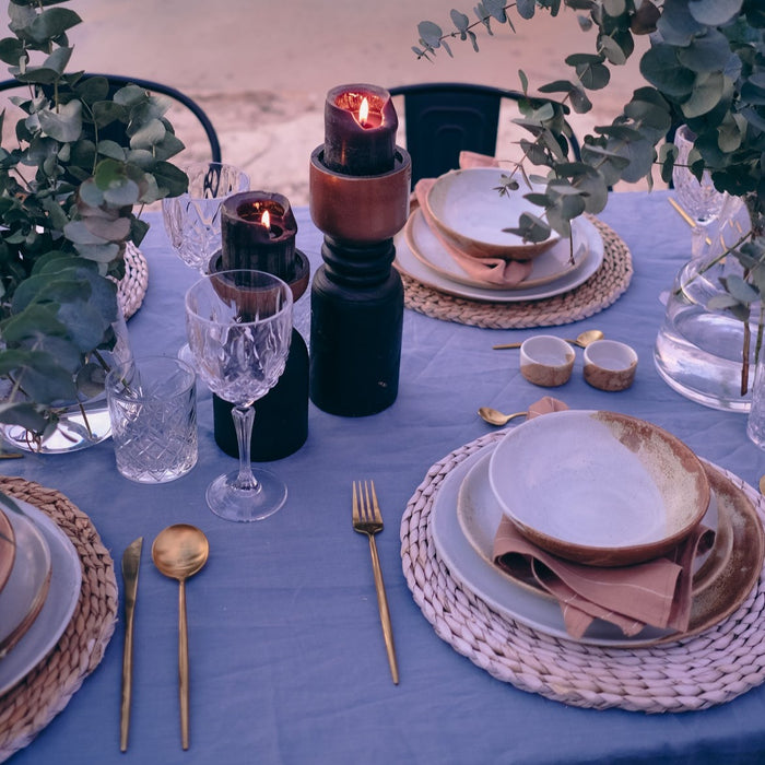 Rustic dinner plate in brown and blue handmade stoneware on outdoor table setting