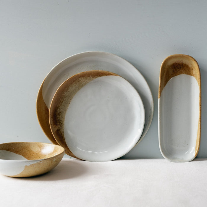 4 piece dinner set staged by Palinopsia Ceramics on a white tablecloth