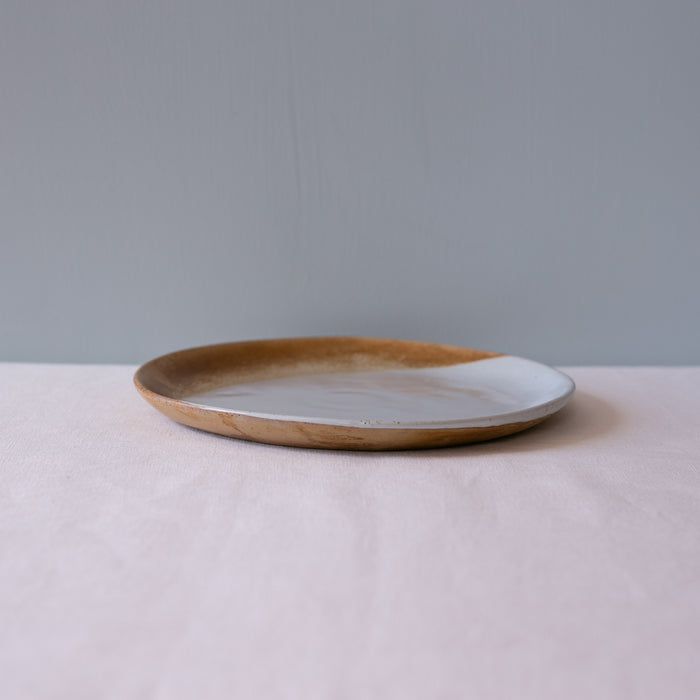 Side view of Palinopsia's handmade soda fired dessert plate