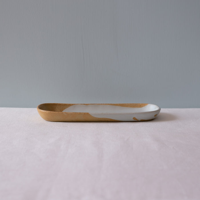 Side view of a mezze rectangle plate in blue and brown by Palinopsia Ceramics
