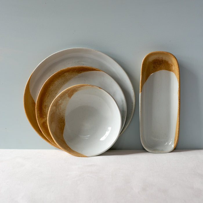4 piece set of dinner plates and bowls by Palinopsia Ceramics in brown and blue