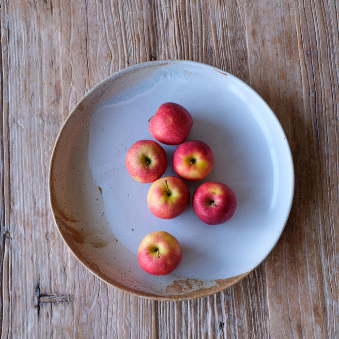 Large fruit low fruit bowl and platter for low salads on timber table top with apples  by Palinopsia