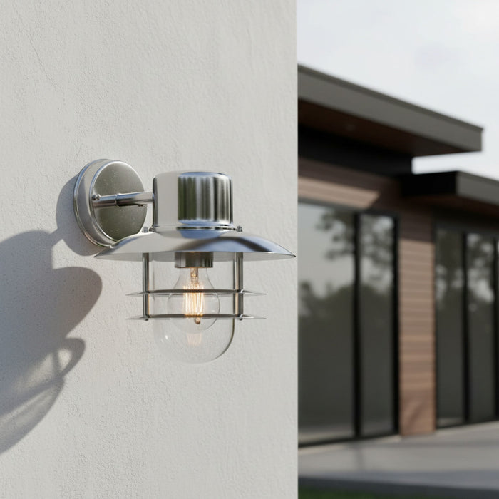 stainless steel exterior lantern sconce mounted on a white exterior wall