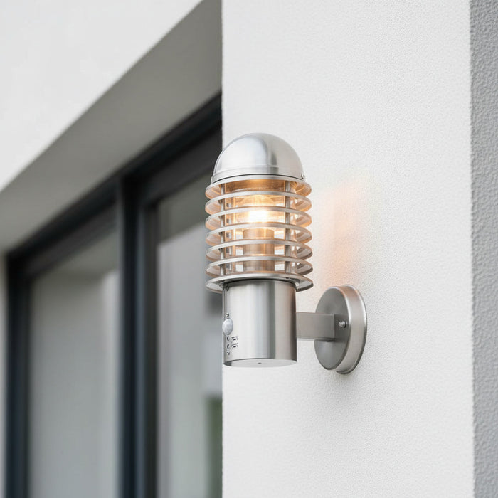 stainless steel PIR sensor outside wall light mounted on the wall outside of a modern home