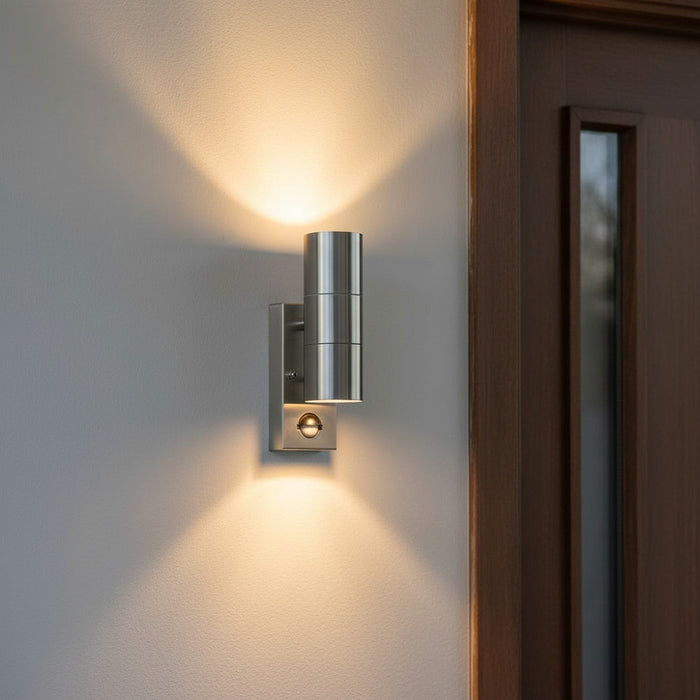 stainless steel PIR outdoor wall light installed on the wall outside a modenr home