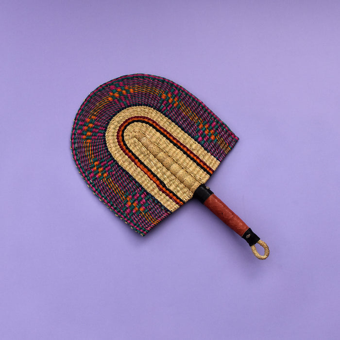 Durable handcrafted fans also known as Bolga fans, are woven from elephant grass and leather and dyed to give them a unique design or patterns. Each hand fan is a one-off piece so once it’s gone it’s gone.   The fans are perfect for keeping cool in the heat and for decorative purposes.   The handle has a loop at the end of the fan which makes it easy for hanging. You can equally mix and match a number of fans together as a piece of art display on the wall. You can also be creative in your own way.